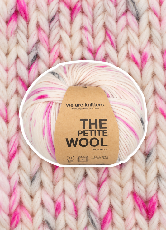 Petite Wool Flamingo yarn ball on a matching knit swatch