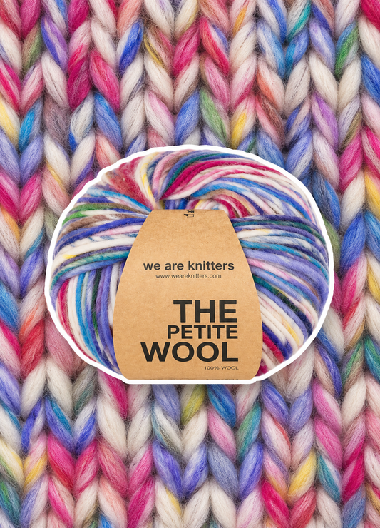 Petite Wool Hand Painted Sprinkle yarn ball on a matching knit swatch