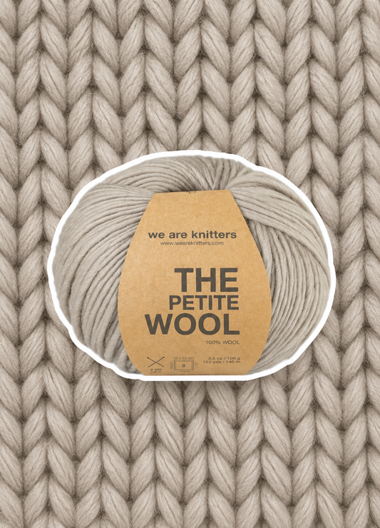 Petite Wool Pearl Grey yarn ball on a matching knit swatch