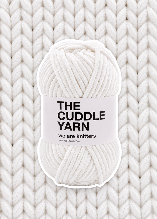 The Cuddle Yarn White chenille skein on a matching knit swatch