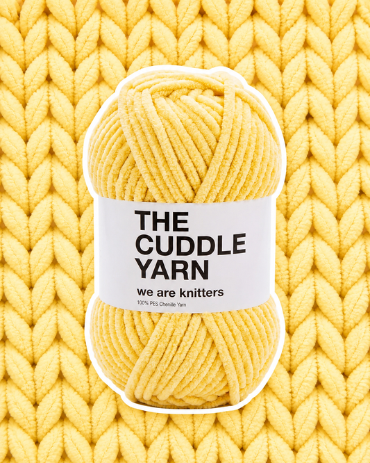 The Cuddle Yarn Yellow chenille skein on a matching knit swatch